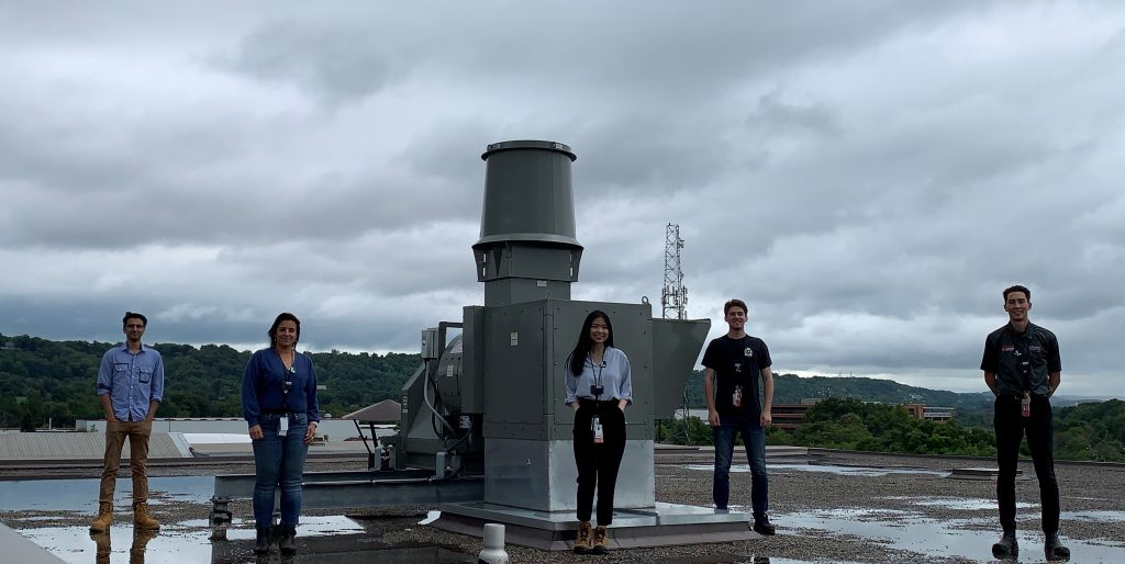 Health Physics members standing in front of McMaster University and Laurentis Energy Partners' CMSR High Plume Fan
