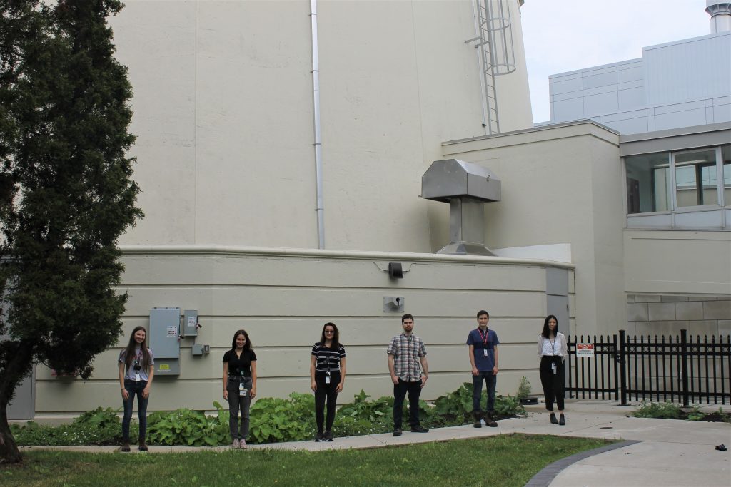 Health Physics 2021 co-op students standing in front of McMaster Nuclear Reactor