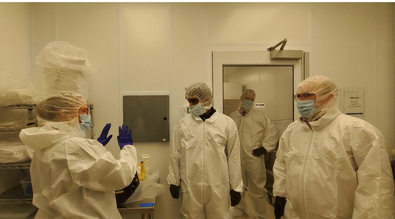 Susan Hogan from the Centre for Probe Development and Commercialization (CPDC) taking Canadian Nuclear Safety Commission (CNSC) inspectors through a laboratory as part of their inspection of Processing Licence activities.